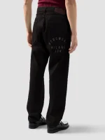 Pantaloni in Denim Trattato Spruzzato GCDS (1)